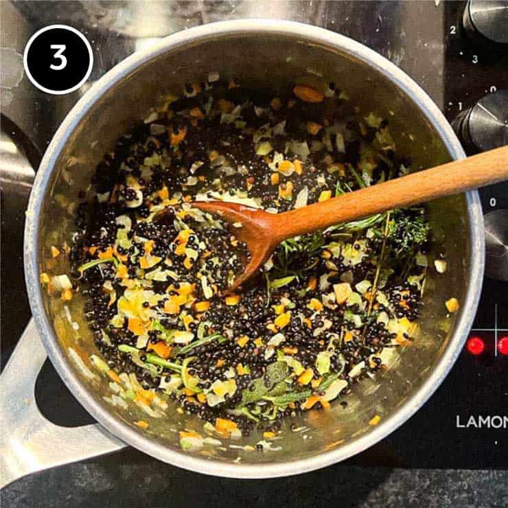 Adding the lentils to the soft vegetables for Salt Pork with Puy Lentils (Petit Sale aux Lentilles)