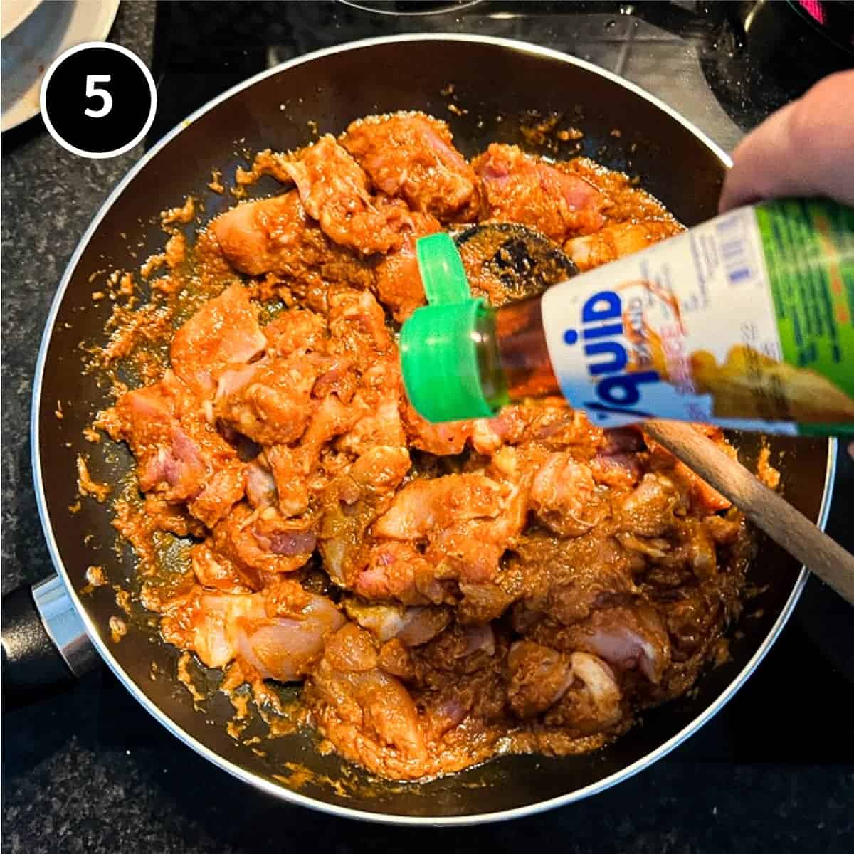 Adding fish sauce to a satay chicken curry