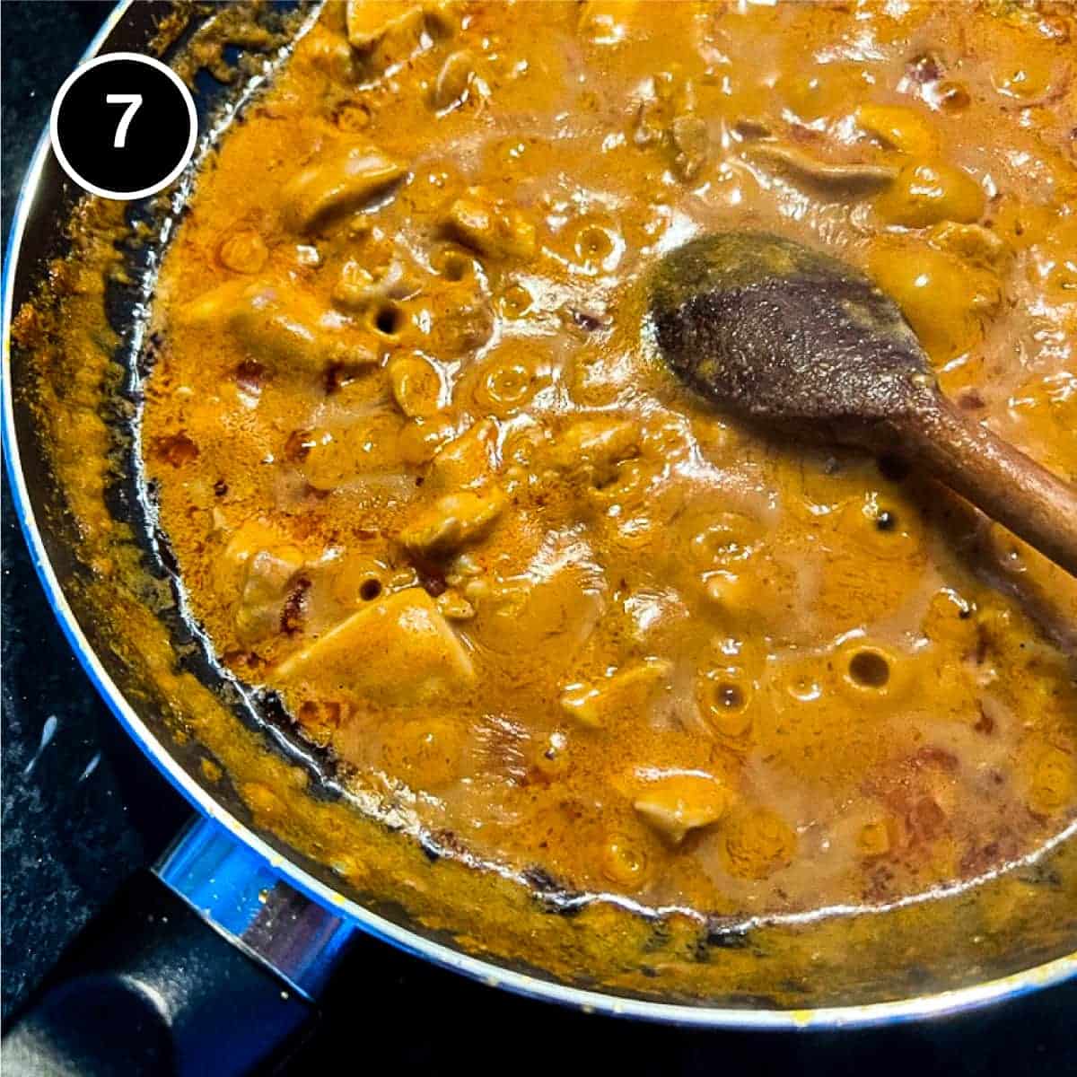 Simmering satay chicken curry