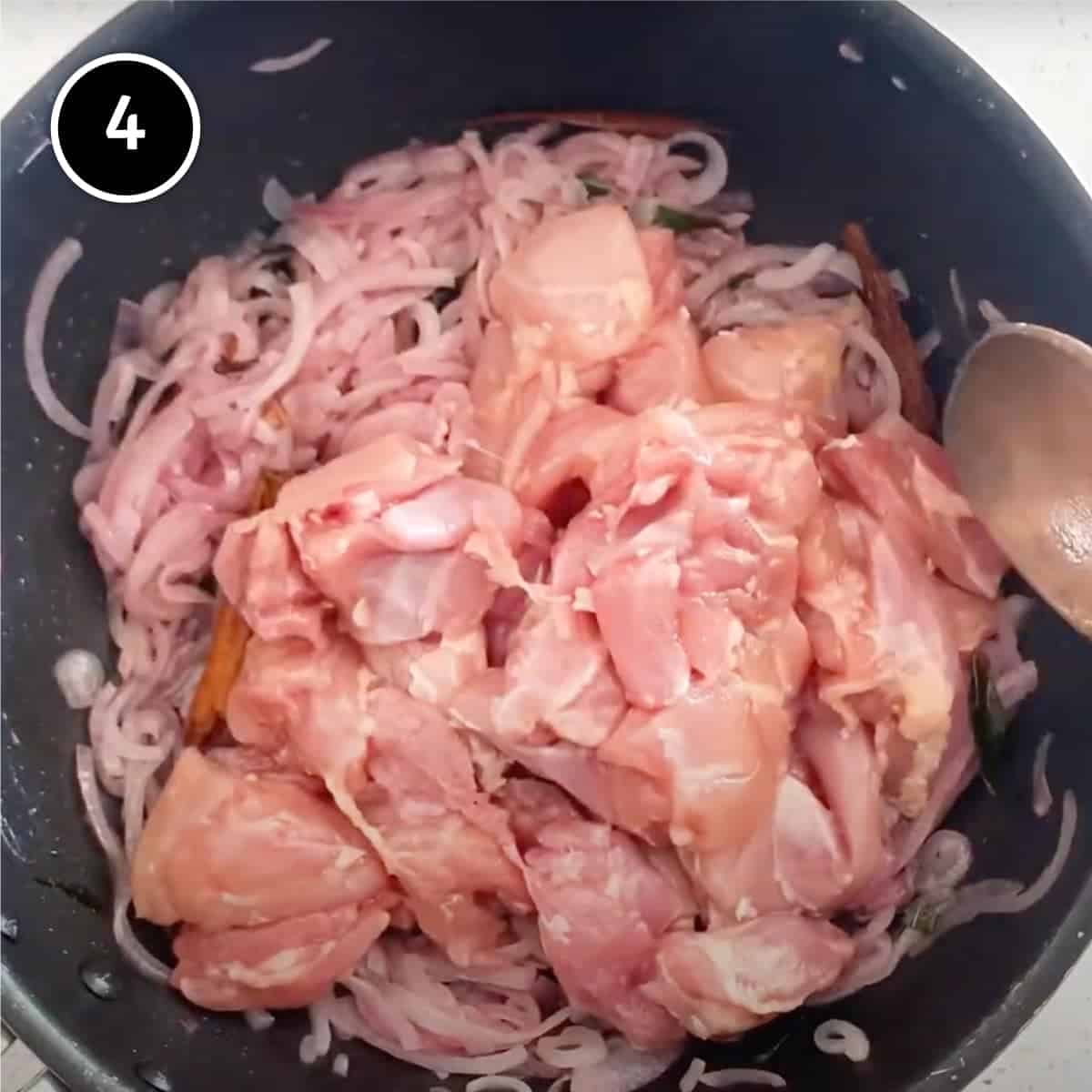 Adding the chicken to onion for Goan Chicken Vindaloo