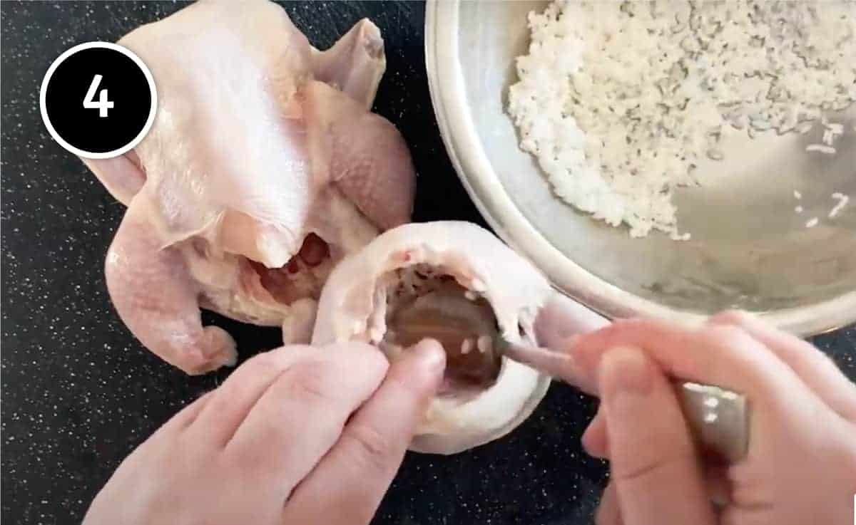 Stuffing small Cornish hens with garlic and rice for Korean Samgyetang (Ginseng Chicken Soup)