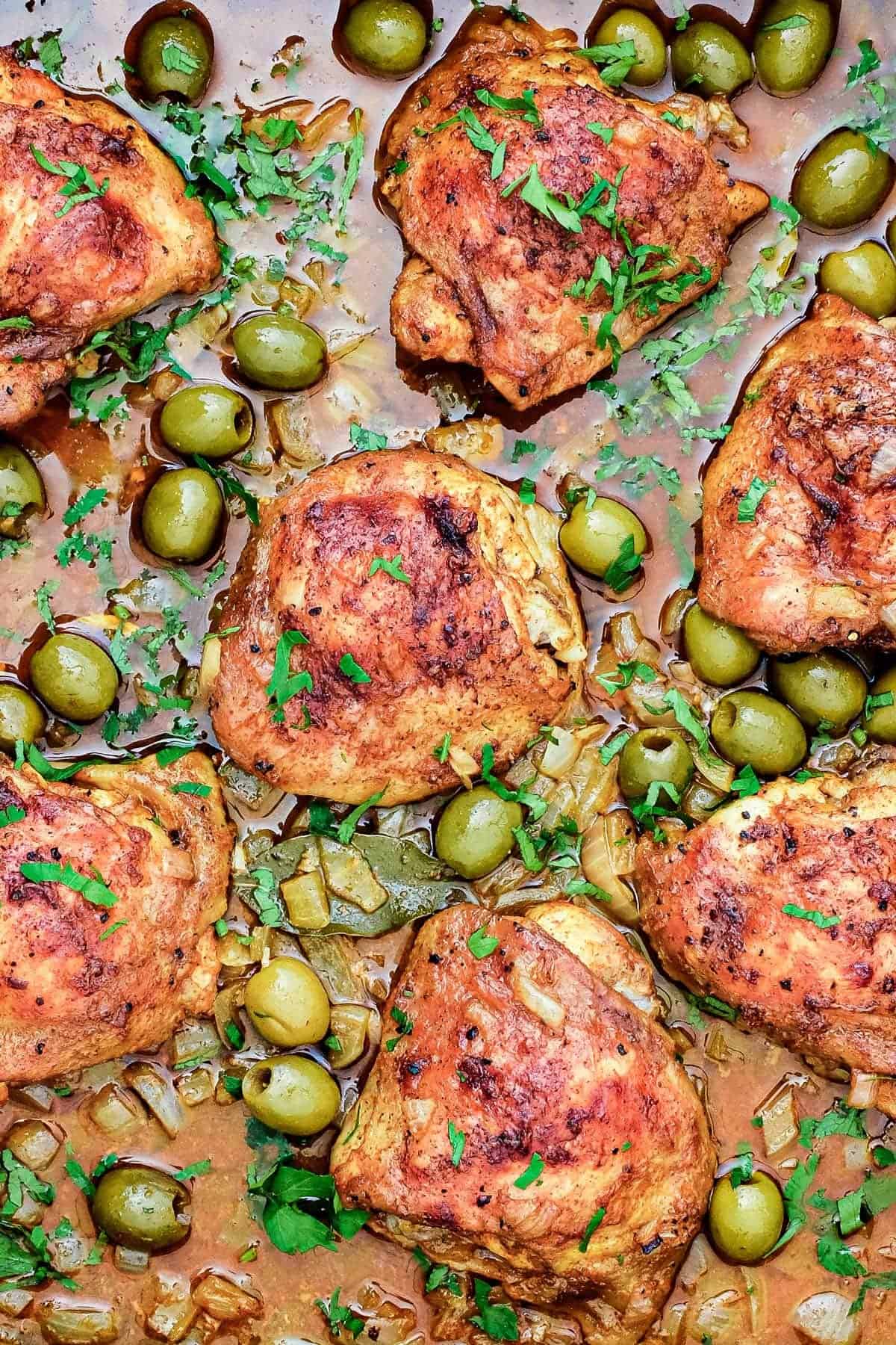 A baking tin with Spanish Chicken and olives