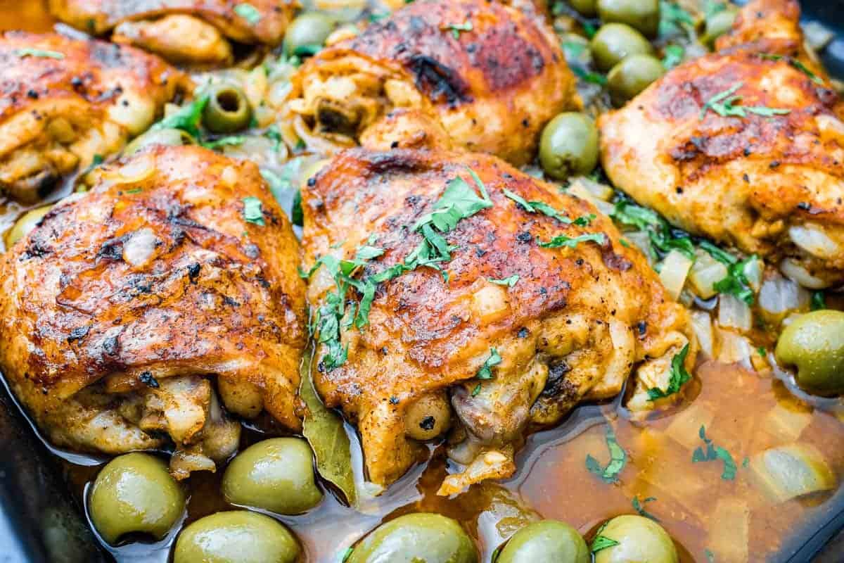 A baking tin with Spanish Chicken and olives