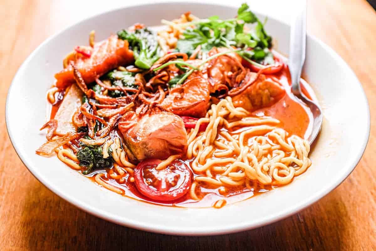 A bowl of Thai Curry Noodle Soup with Salmon