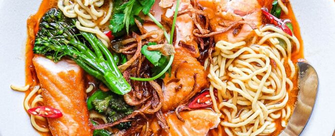 A bowl of Thai Curry Noodle Soup with Salmon