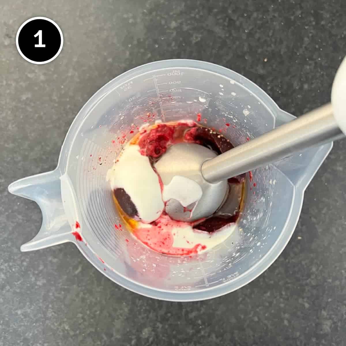 An immersion blender blends all the ingredients for a Turkish beetroot & yoghurt dip.