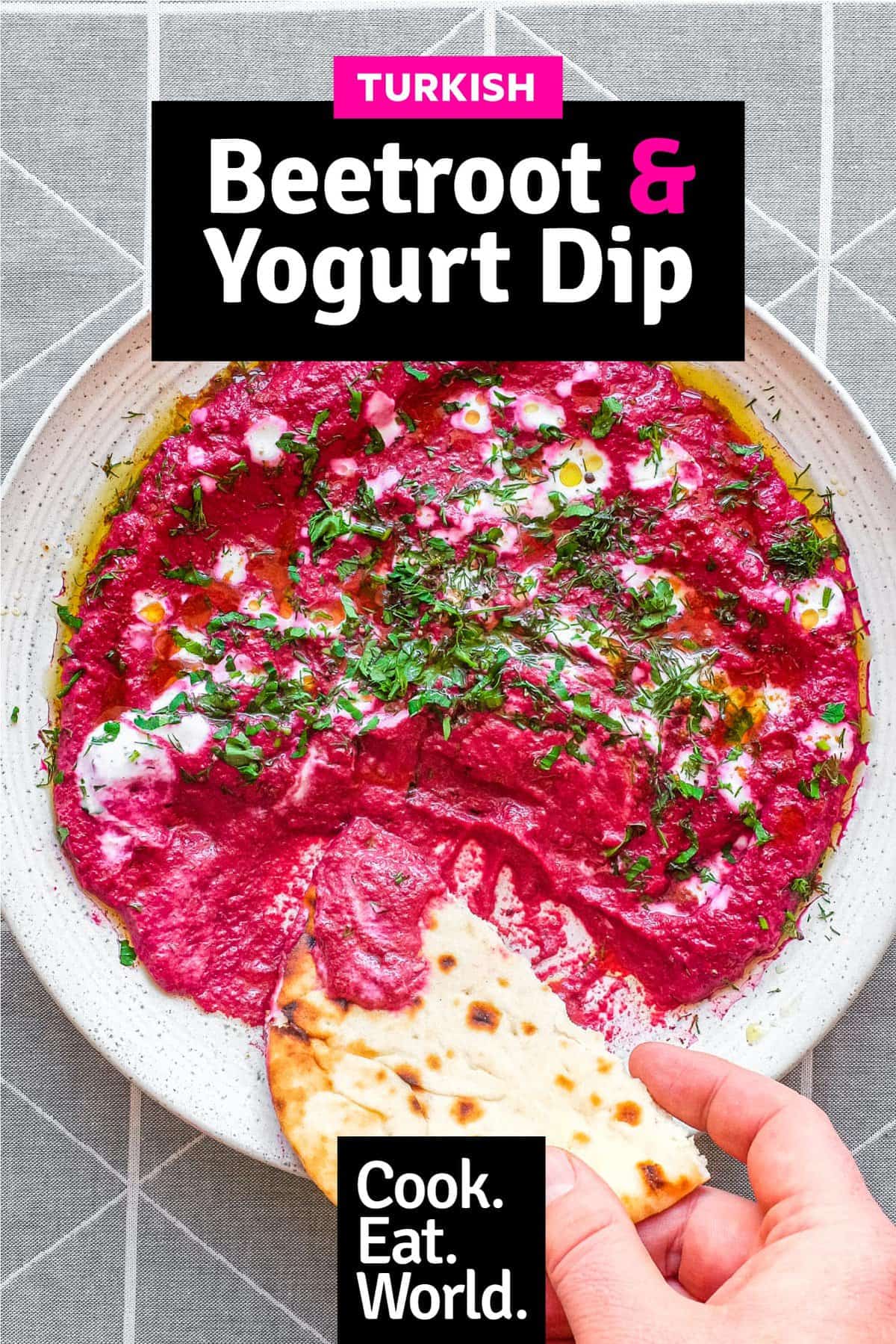 A bowl of beetroot dip scattered with herbs and yoghurt, served with flatbreads