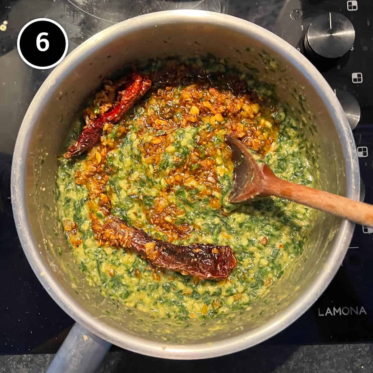 Stirring the tadka into the Spinach Dal (Dal Palak)