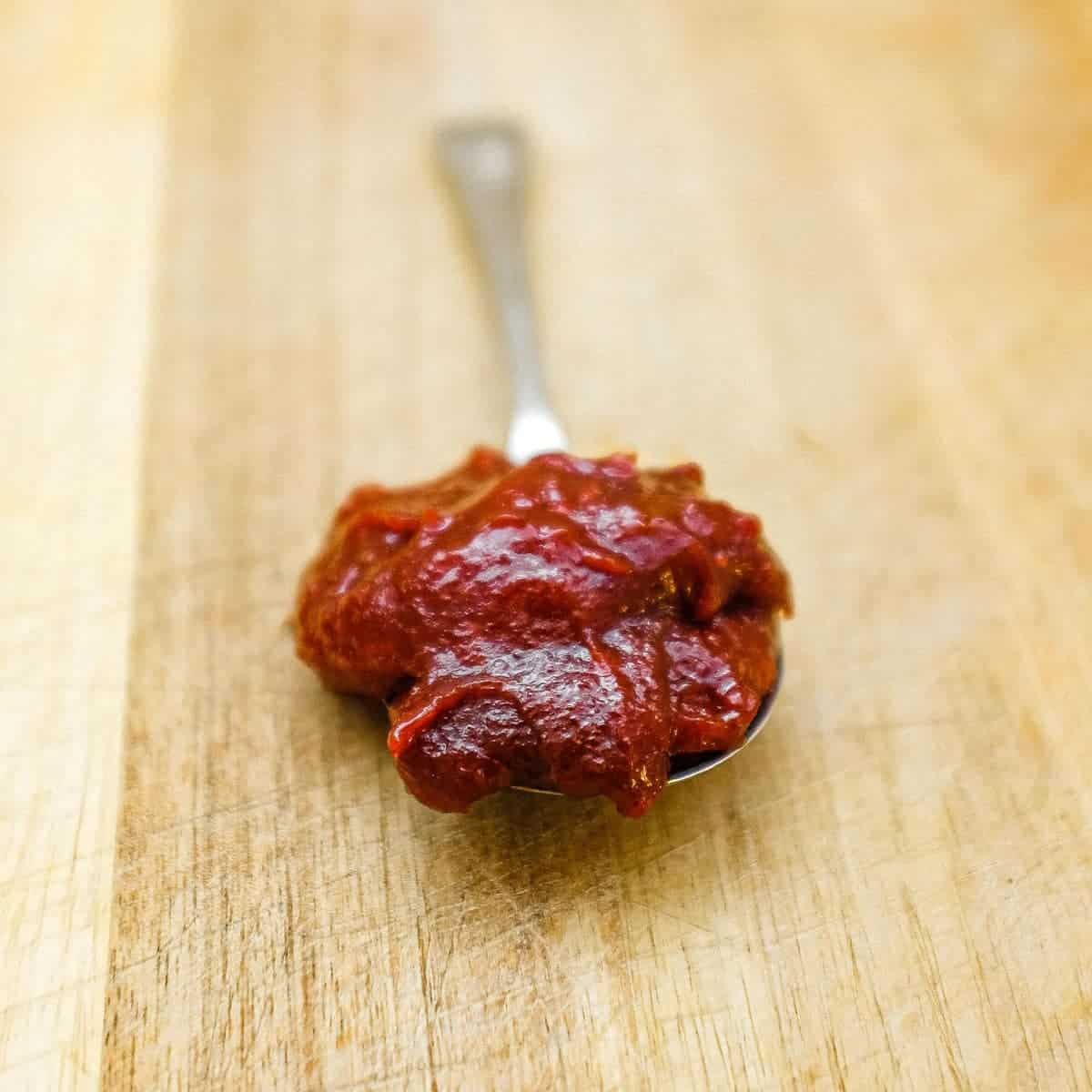 A close up of a spoonful of Gochujang Sauce