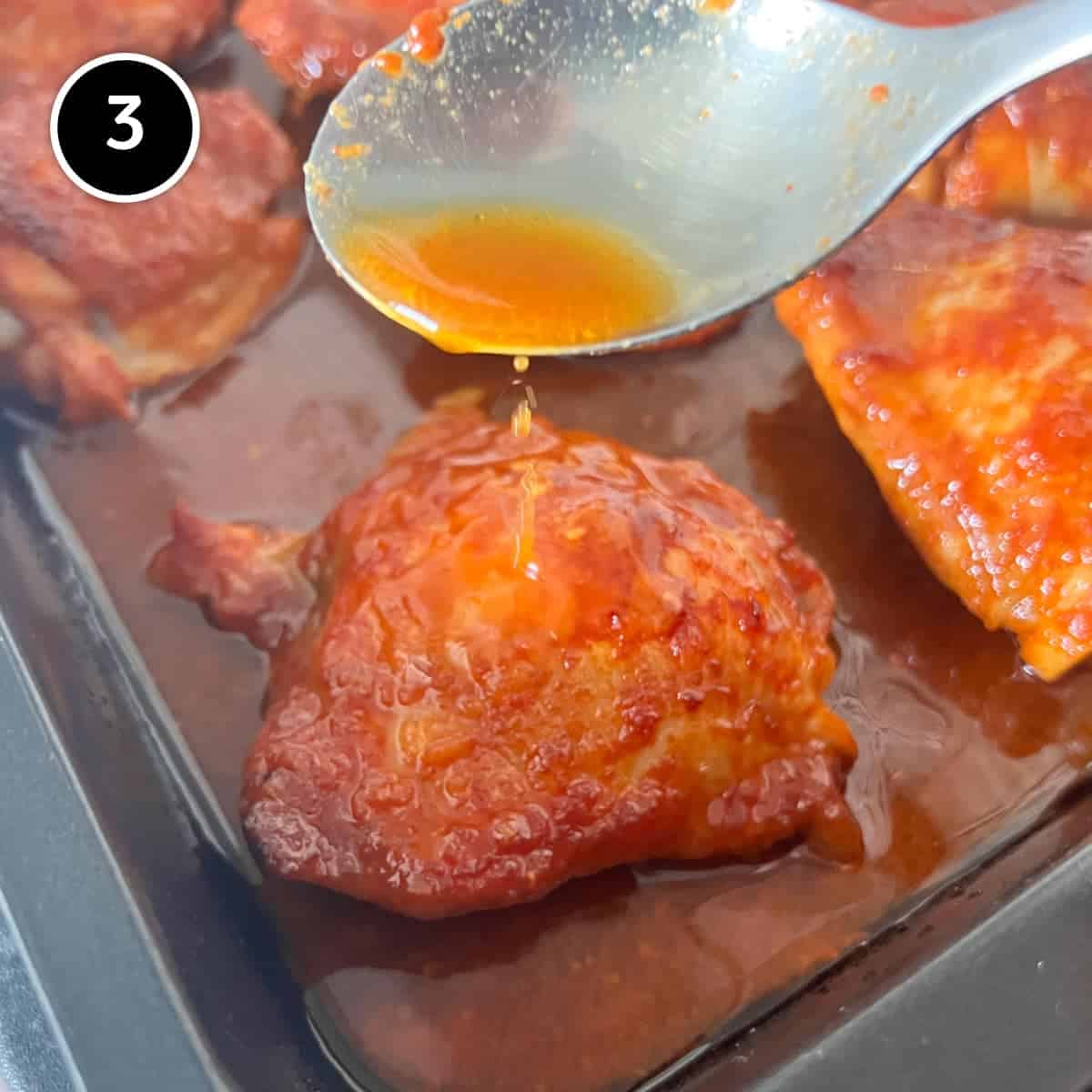 Basting the Gochujang chicken with the pan juices