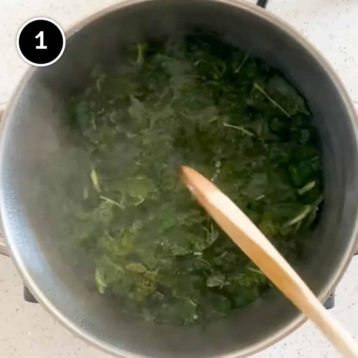 Boiling the cavolo nero in a pan of water