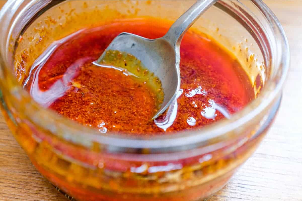 A small jar of homemade Pilpelchuma hot sauce.