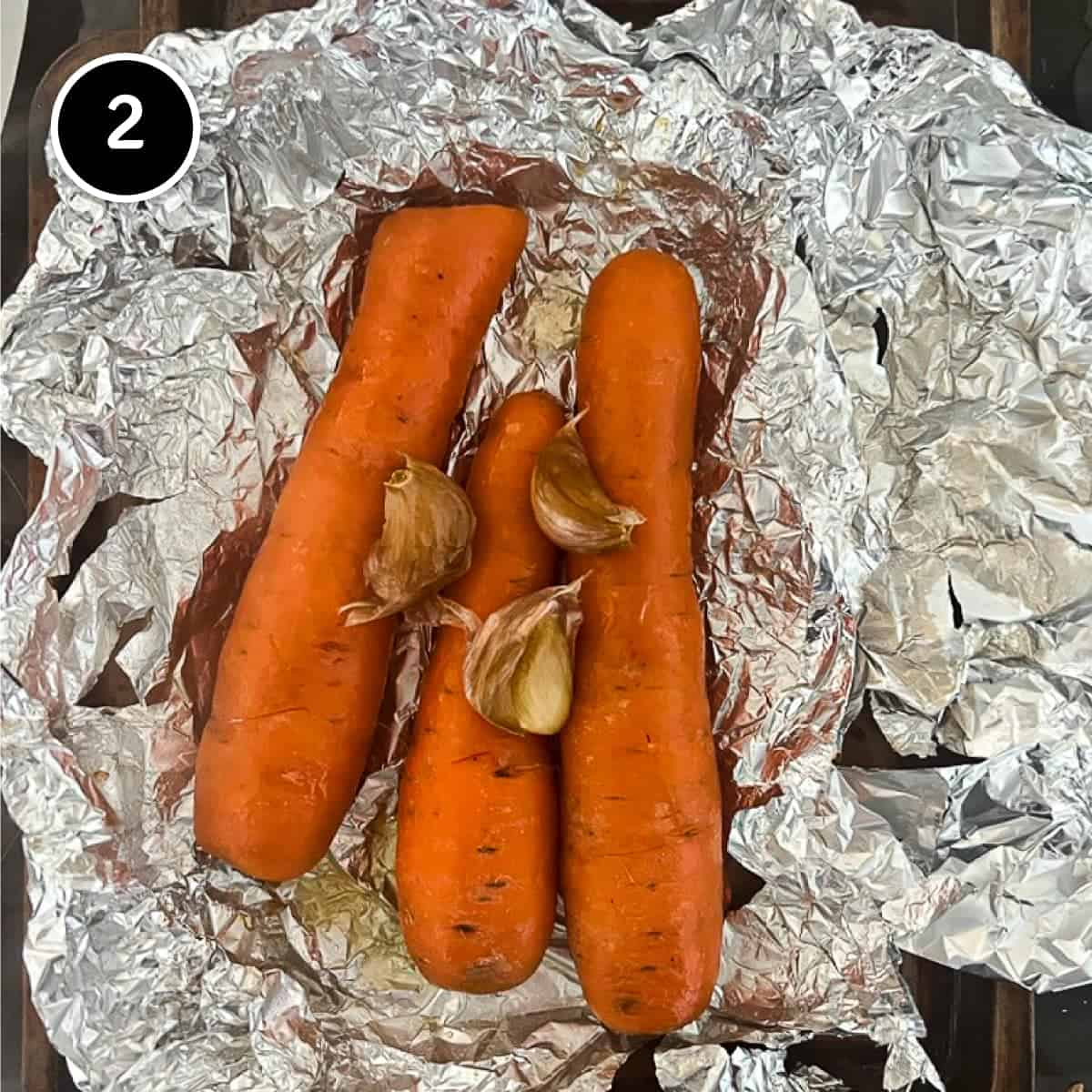 Roasted carrots and garlic in foil