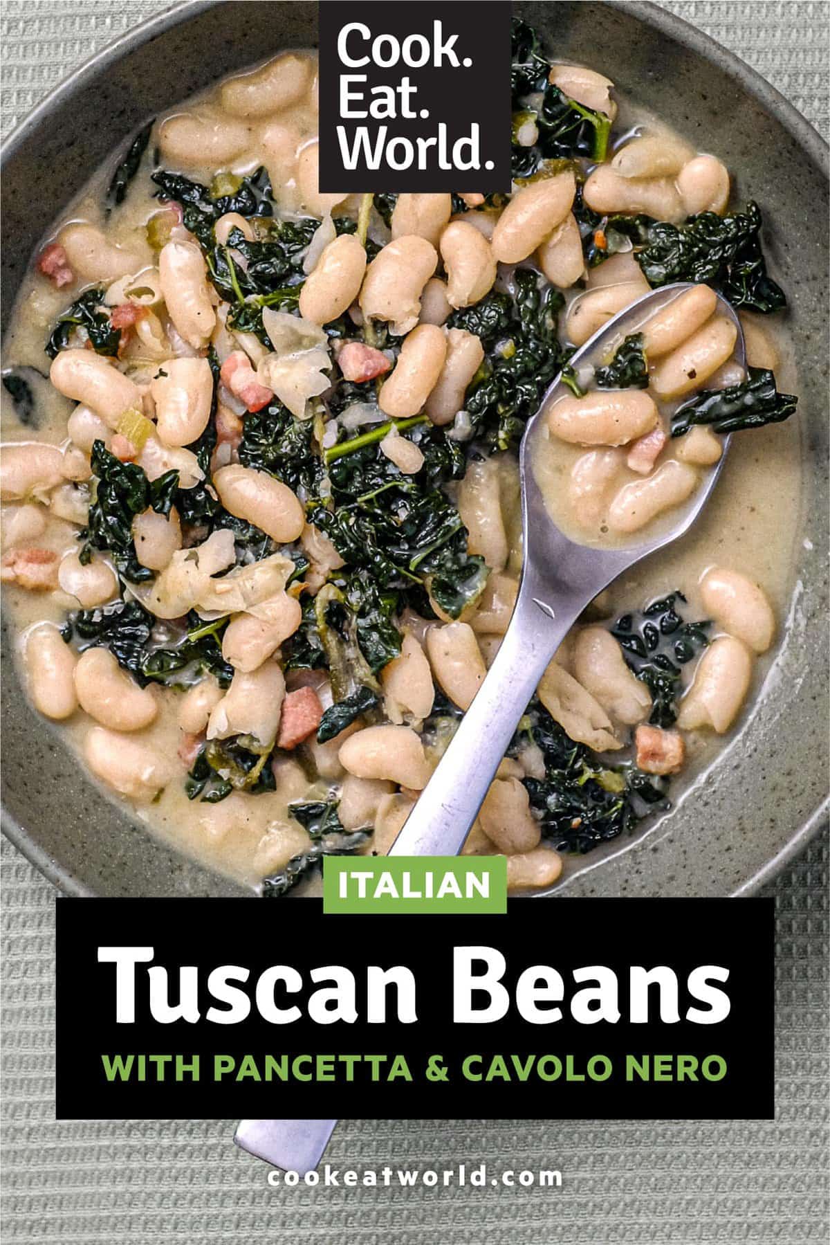 A bowl of Tuscan Beans with pancetta and cavolo nero cabbage in a bowl with a spoon