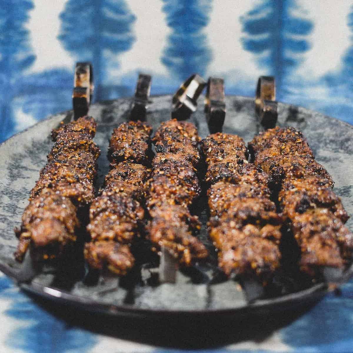 Chinese Xinjiang Lamb Skewers on a platter