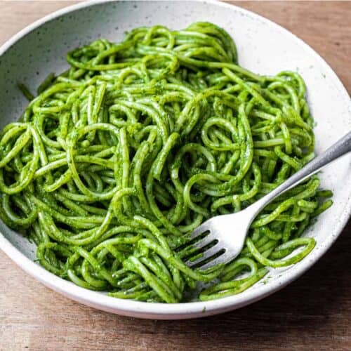 A bowl of spaghetti in a green puree of cavolo nero cabbage