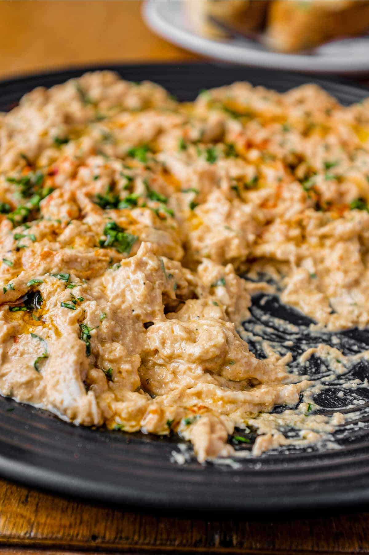 A plate of Turkish Circassian Chicken with a fork