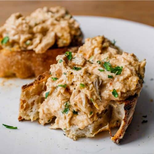 A slice of crusty bread topped with Turkish Circassian Chicken