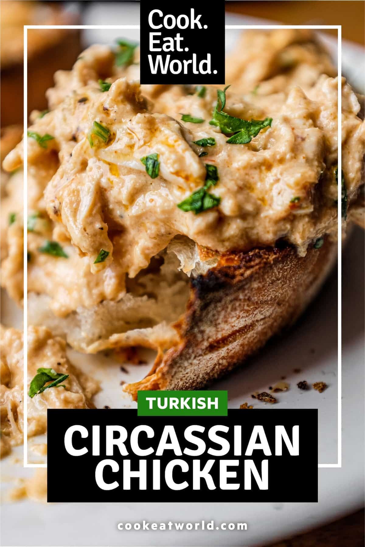 A slice of crusty bread topped with Turkish Circassian Chicken