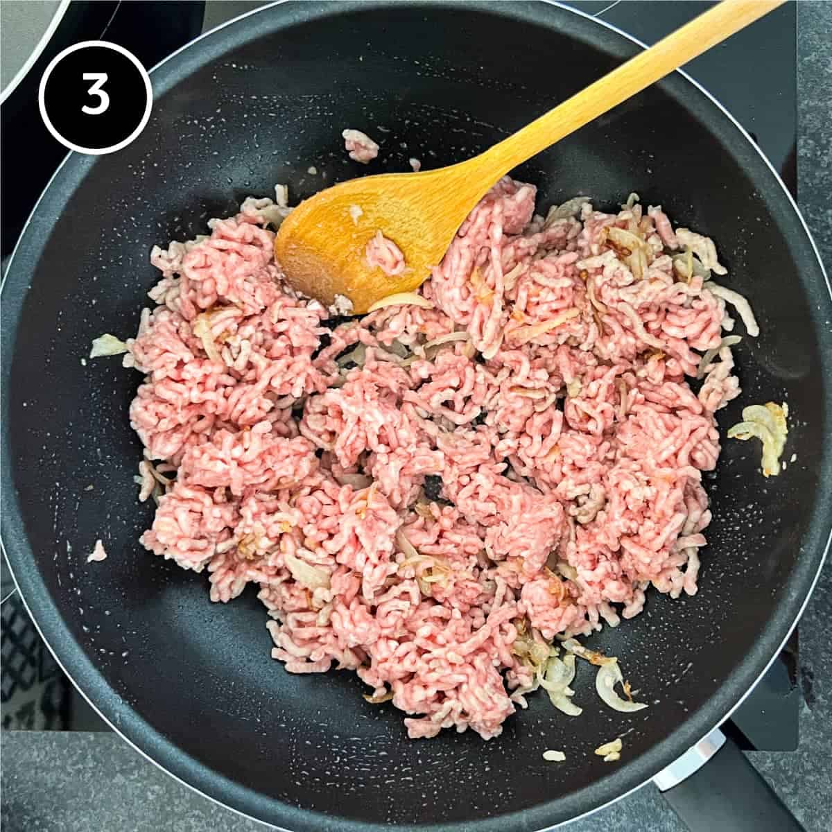 Pork and onion frying in a wok