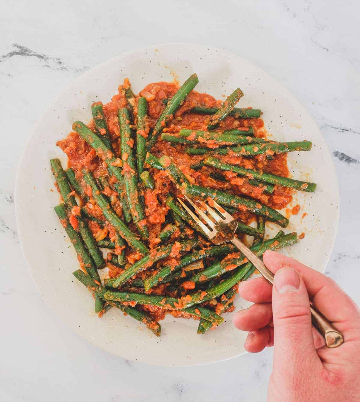 Green Beans (French Beans) cooked in a tangy red tomato sauce with Turkish Aleppo Pepper