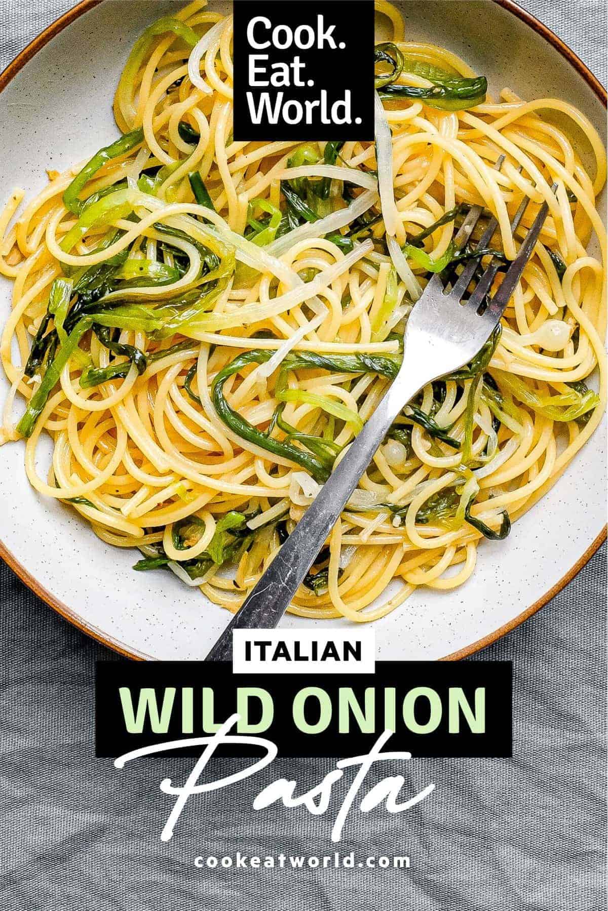 A bowl of spaghetti and wild onions with a fork