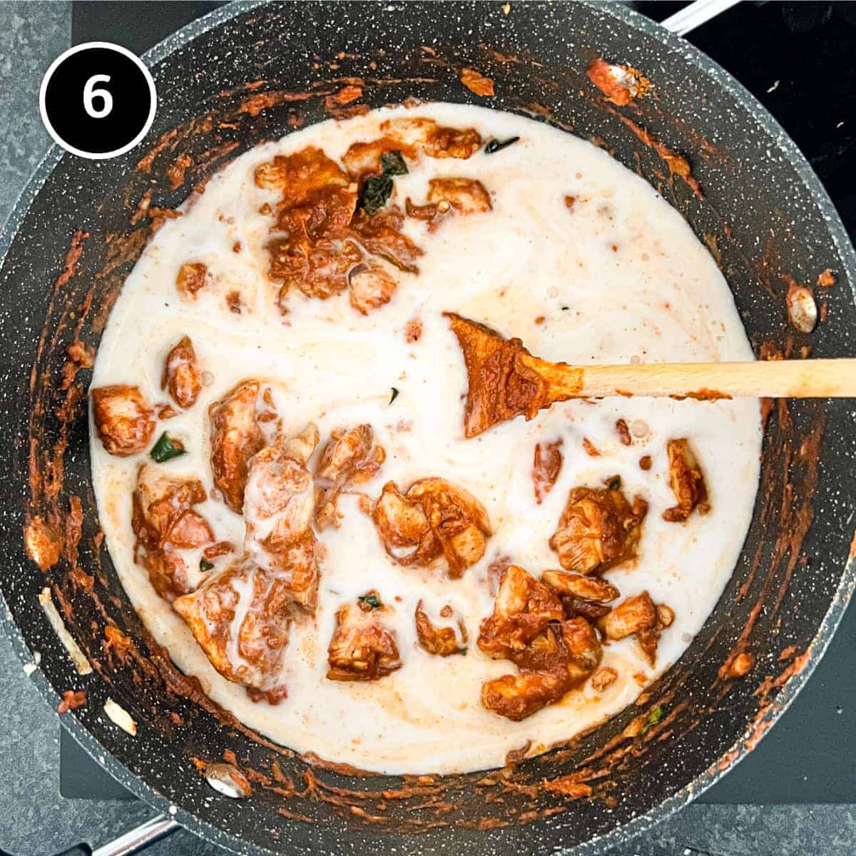 Coconut milk being added to a Sri Lankan chicken curry - Chicken Ceylon