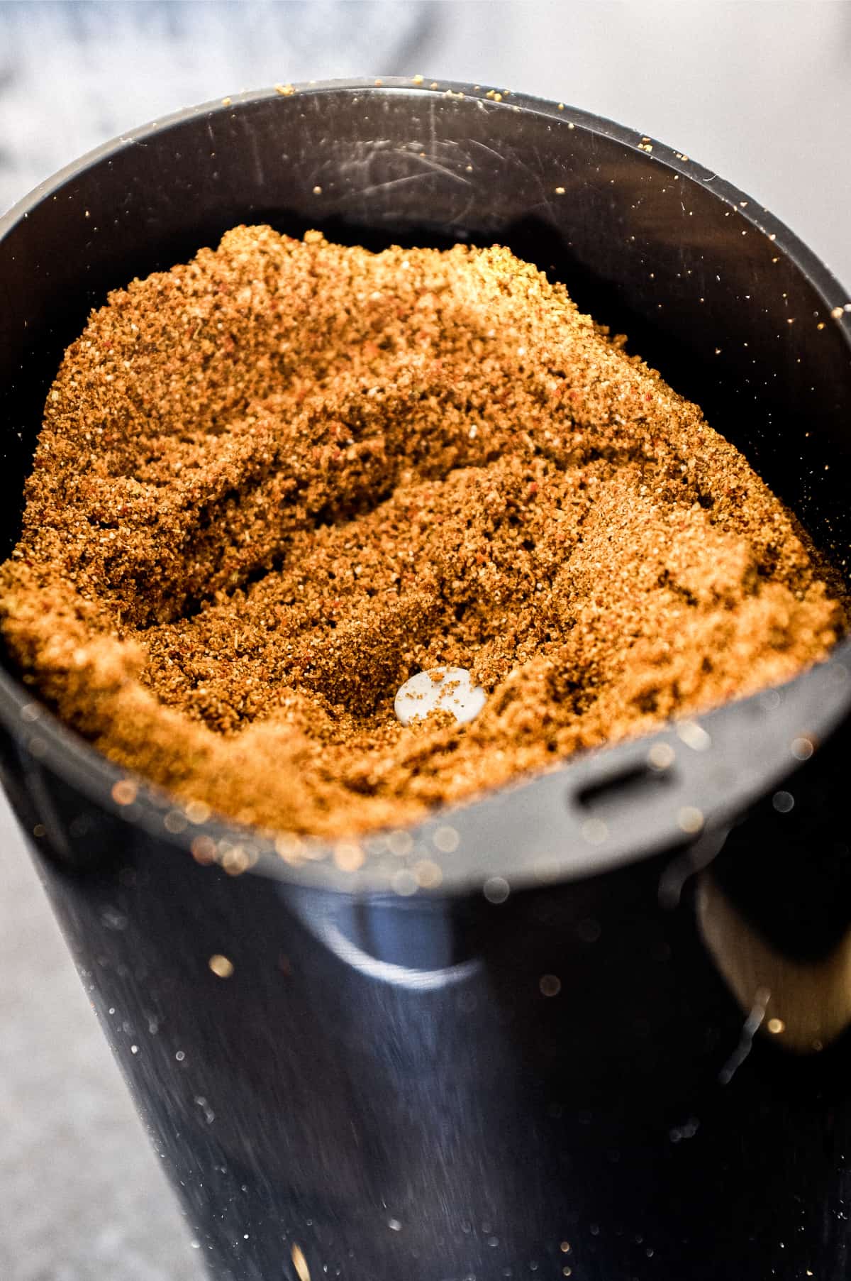 Sri Lankan curry powder in a spice grinder