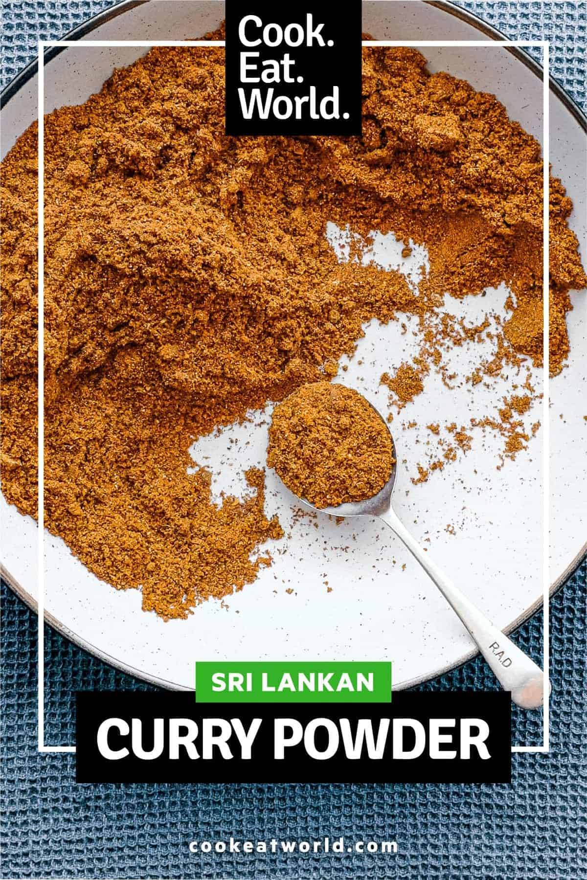 A small bowl of Sri Lankan curry powder with a spoon