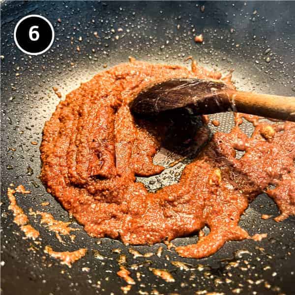 a paste of tomato and spices in a pan
