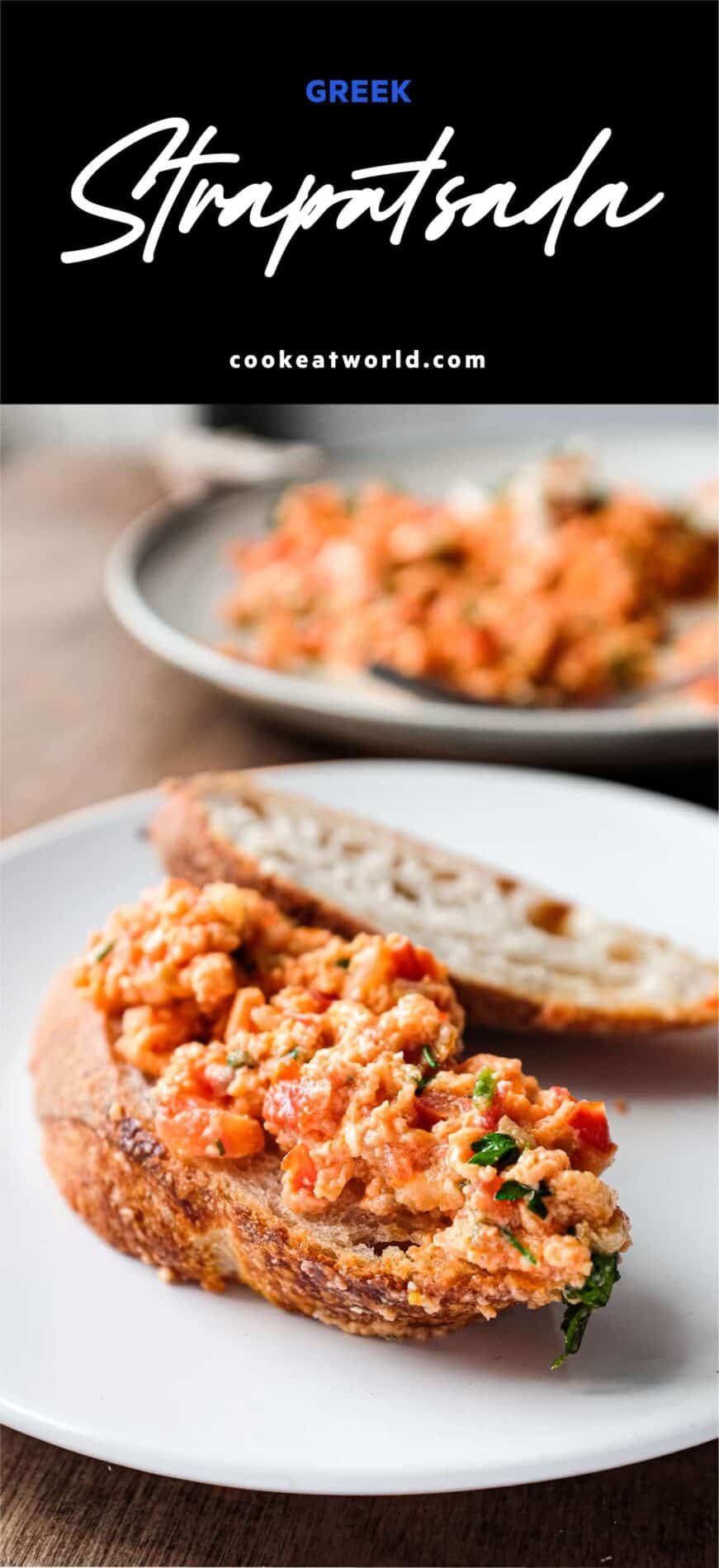 A plate of Greek Strapatsada scattered with feta cheese and parsley. Crusty bread and a fork sits alongside.