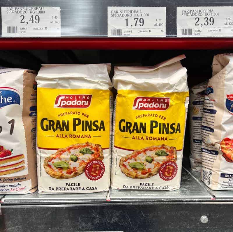 two packets of Italian pinsa dough on an Italian supermarket shelf