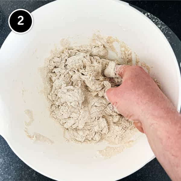 Pinsa dough being mixed by hand