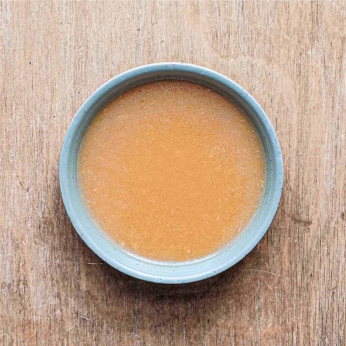 Miso dressing in a small bowl