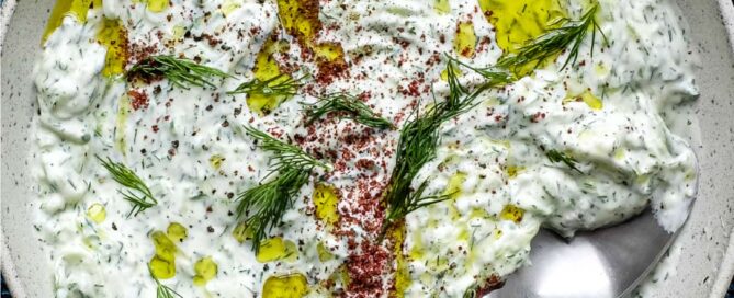 A bowl of Turkish Cacik - a yoghurt and cucumber meze or condiment