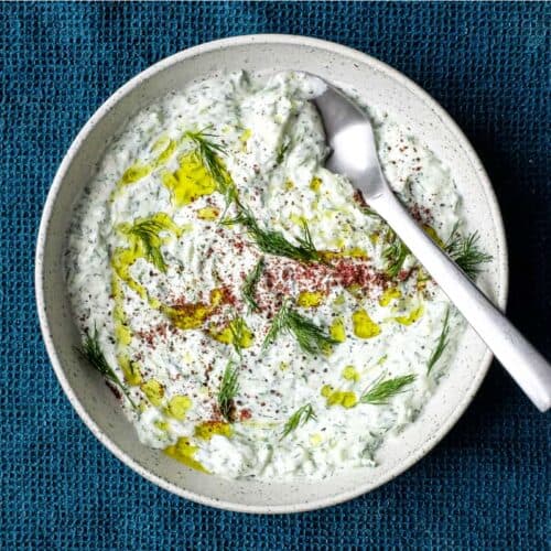 A bowl of Turkish Cacik - a yoghurt and cucumber meze or condiment