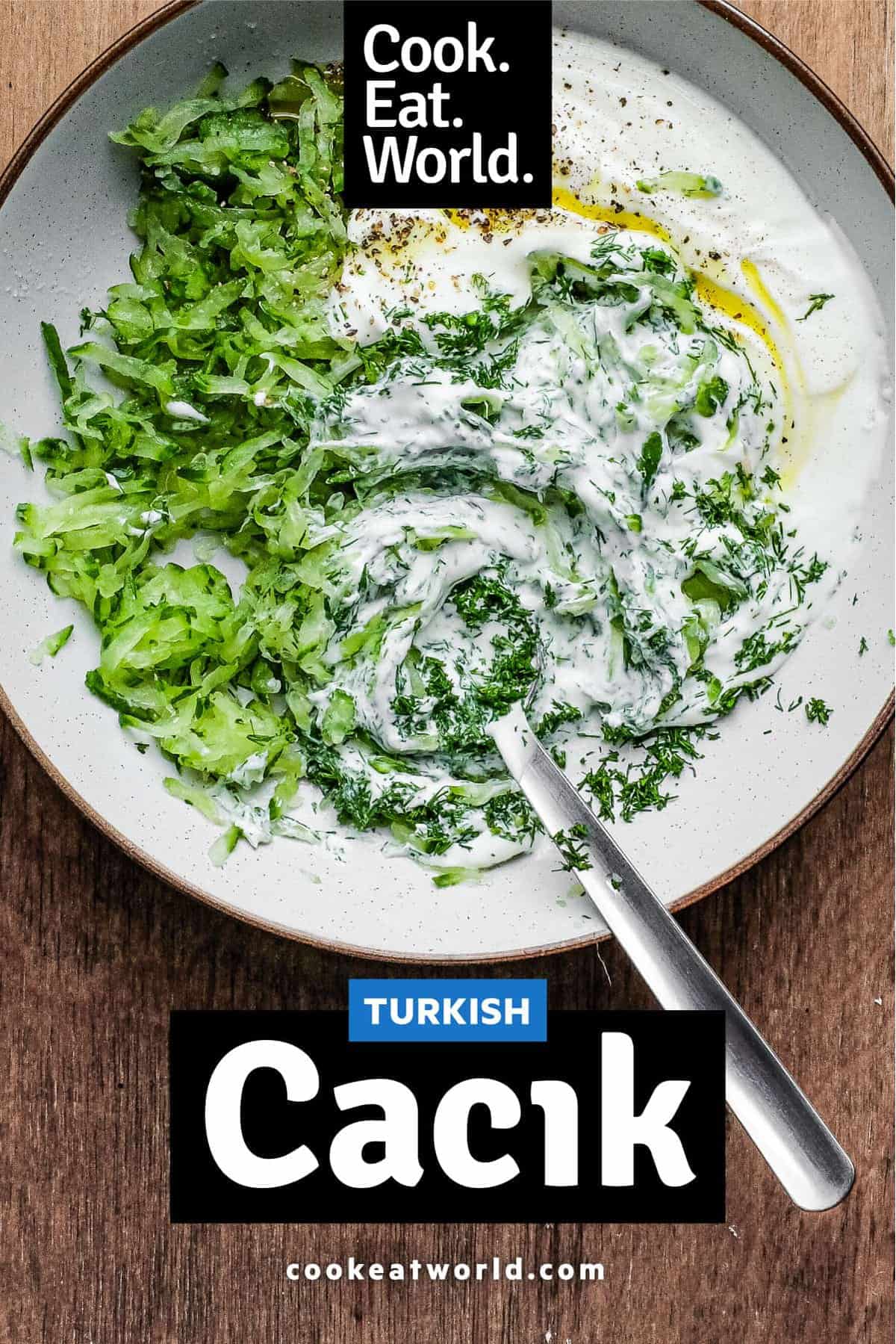 Mixing the bowl of Turkish Cacik - a yoghurt and cucumber meze or condiment