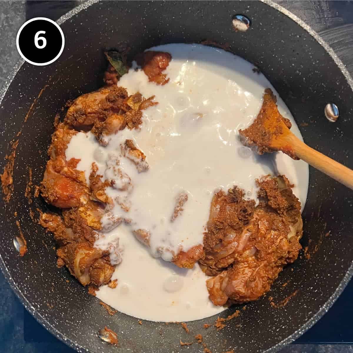 Adding coconut milk to a chicken Madras curry
