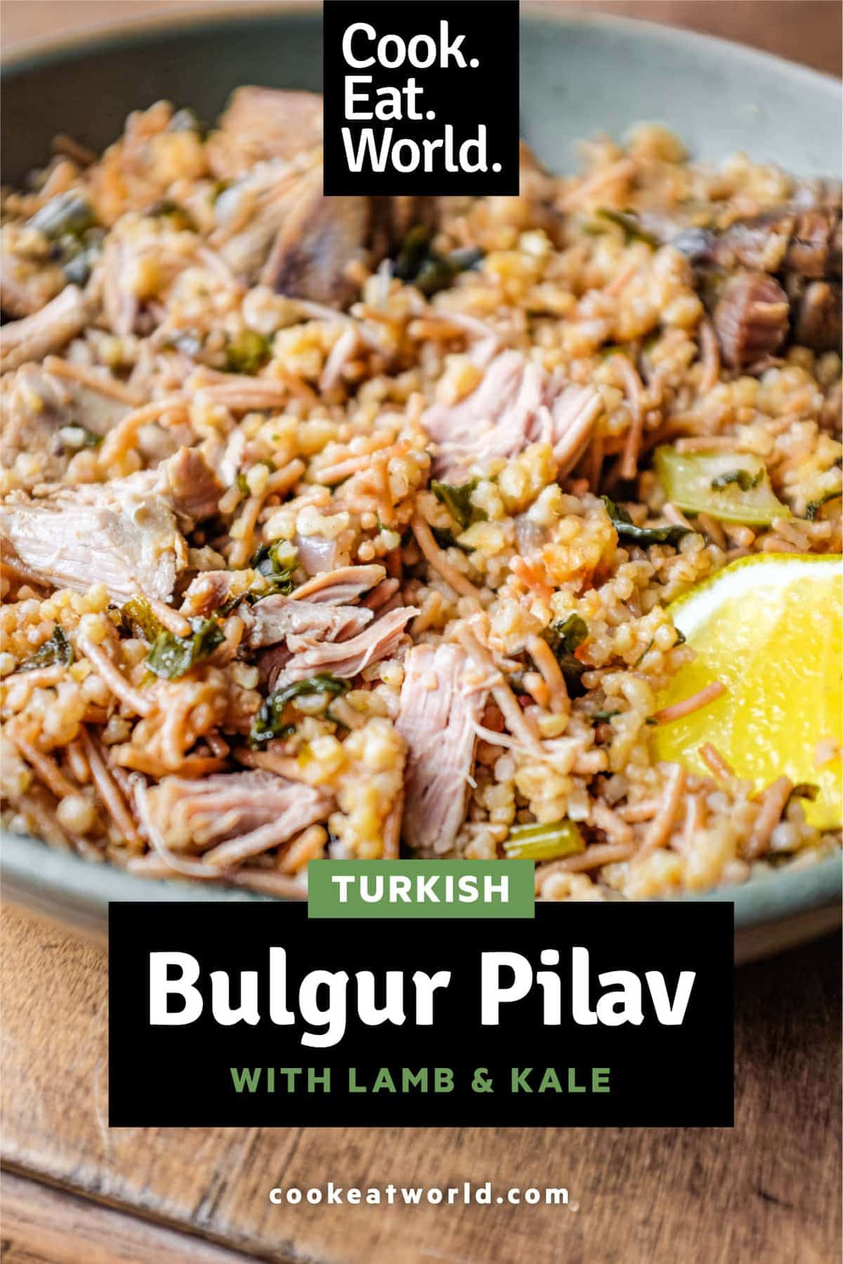 A bowl of Turkish bulgur pilav with a fork and a wedge of lemon.