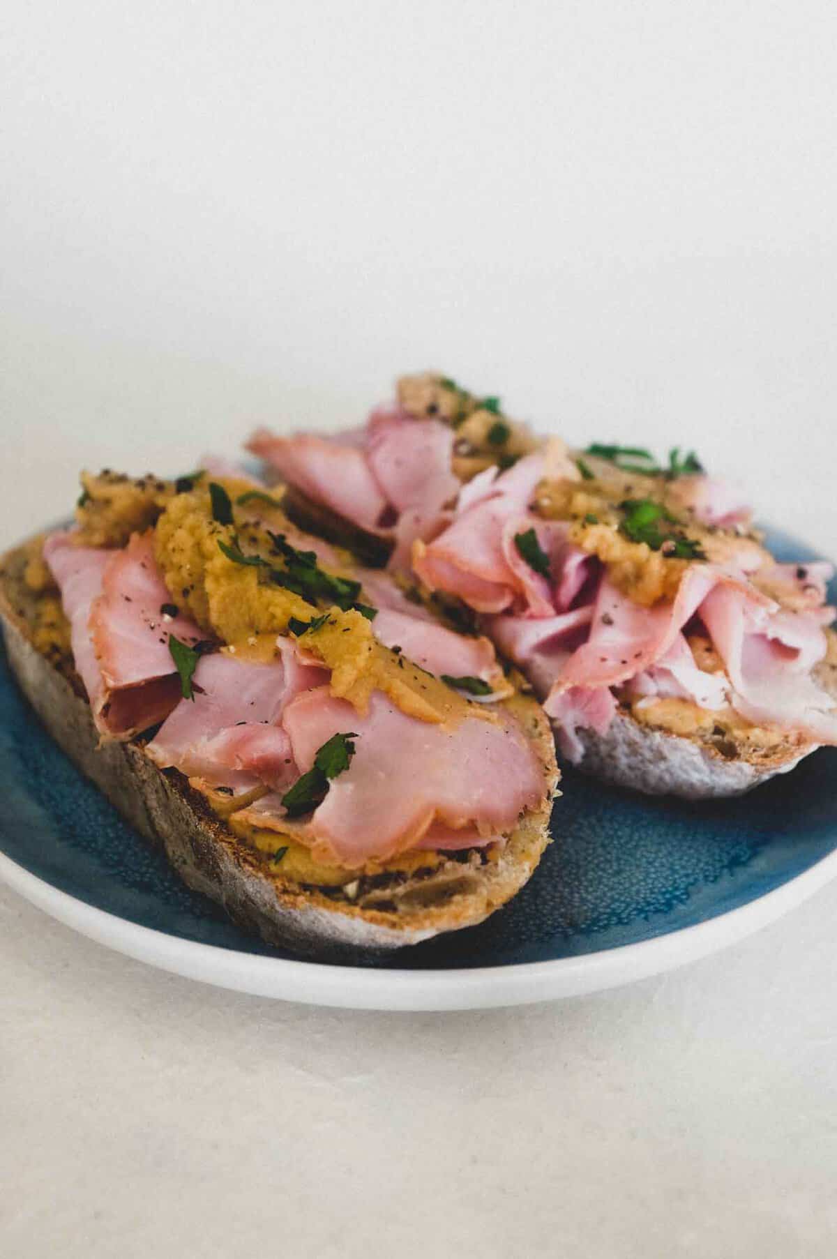 Pease Pudding with Ham | cookeatworld.com A an open sandwich with ham and pease pudding.