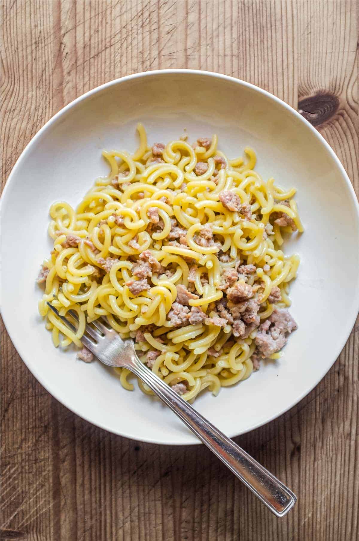 A bowl of Gramigna pasta with sausage