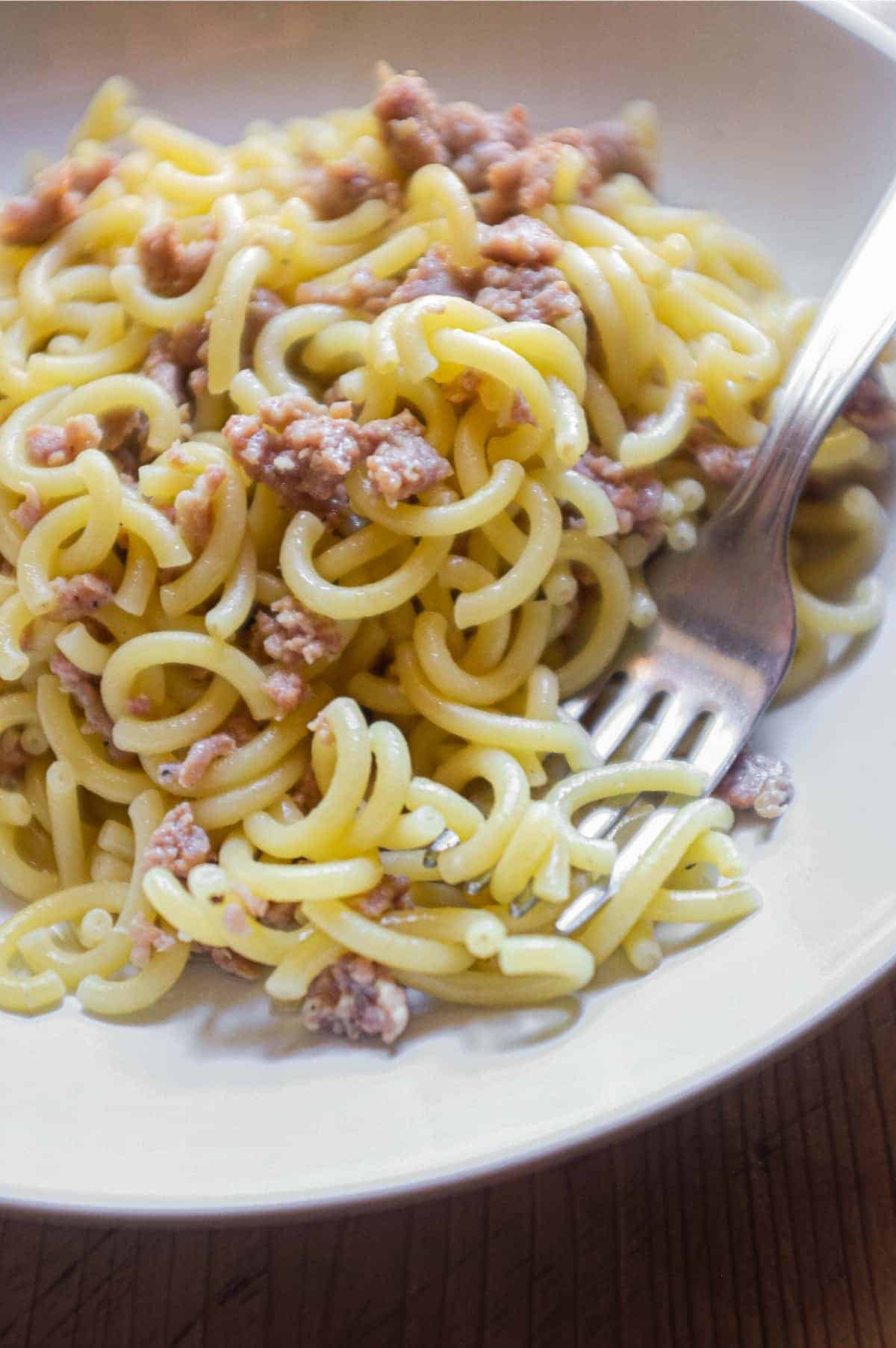 A bowl of Gramigna pasta with sausage