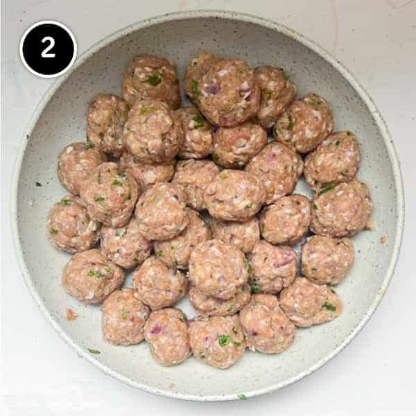 Raw lamb meatballs in bowl