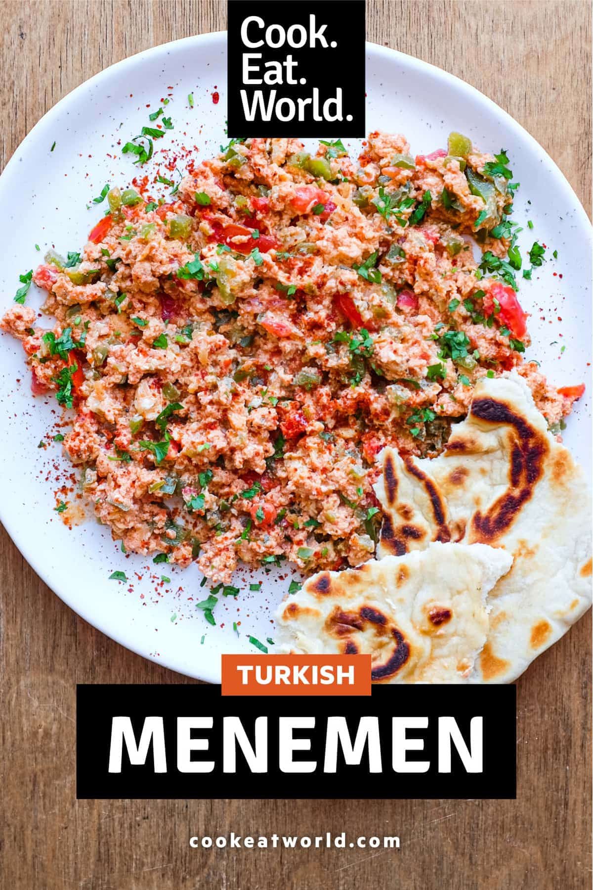 A plate of Turkish Menemen with flatbreads on the side