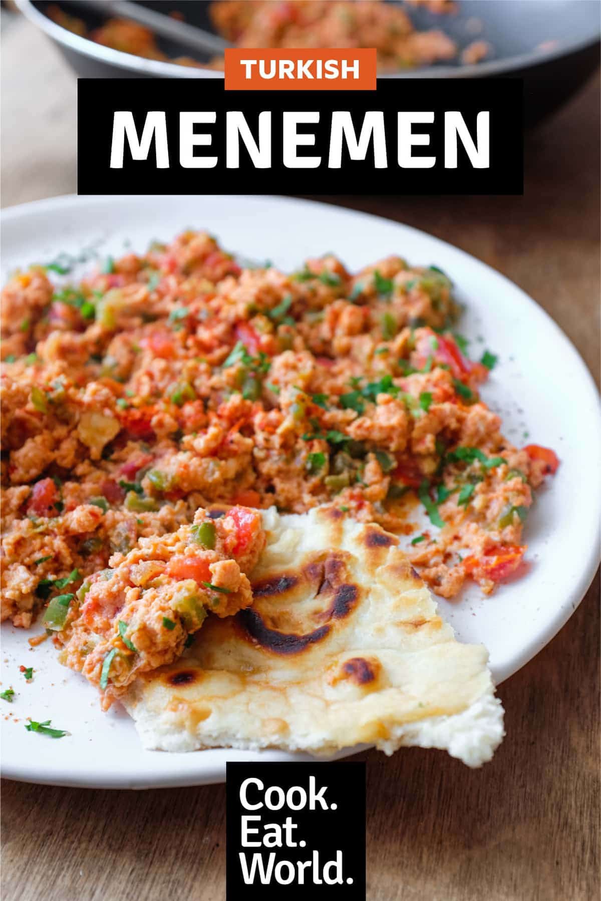 A plate of Turkish Menemen with flatbreads on the side