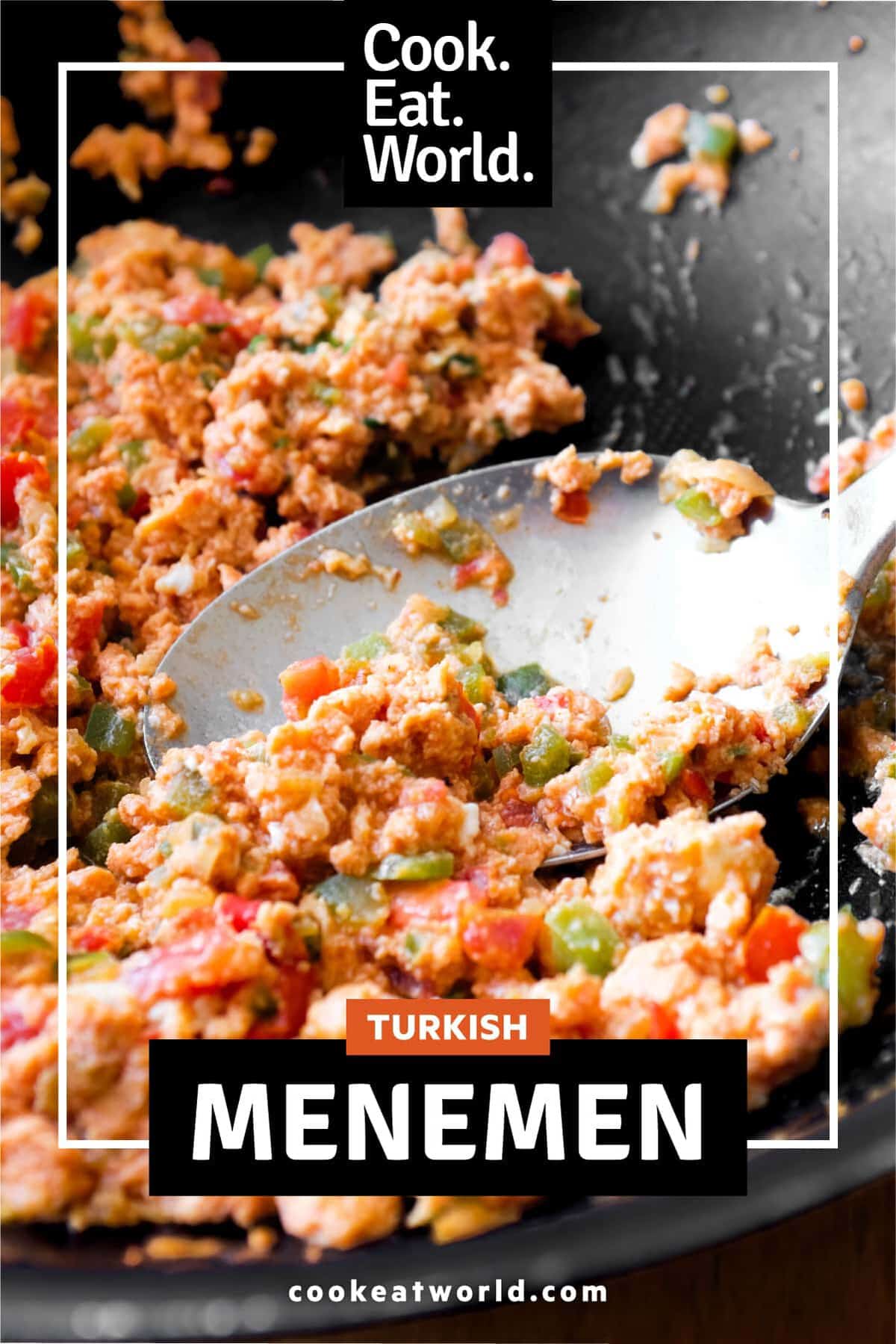 A pan of Turkish Menemen with a large serving spoon