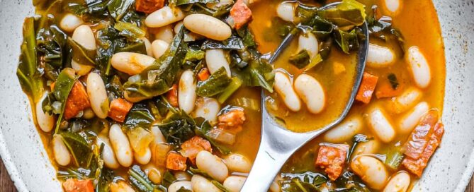 A bowl of Spanish Bean and Chorizo stew with a spoon