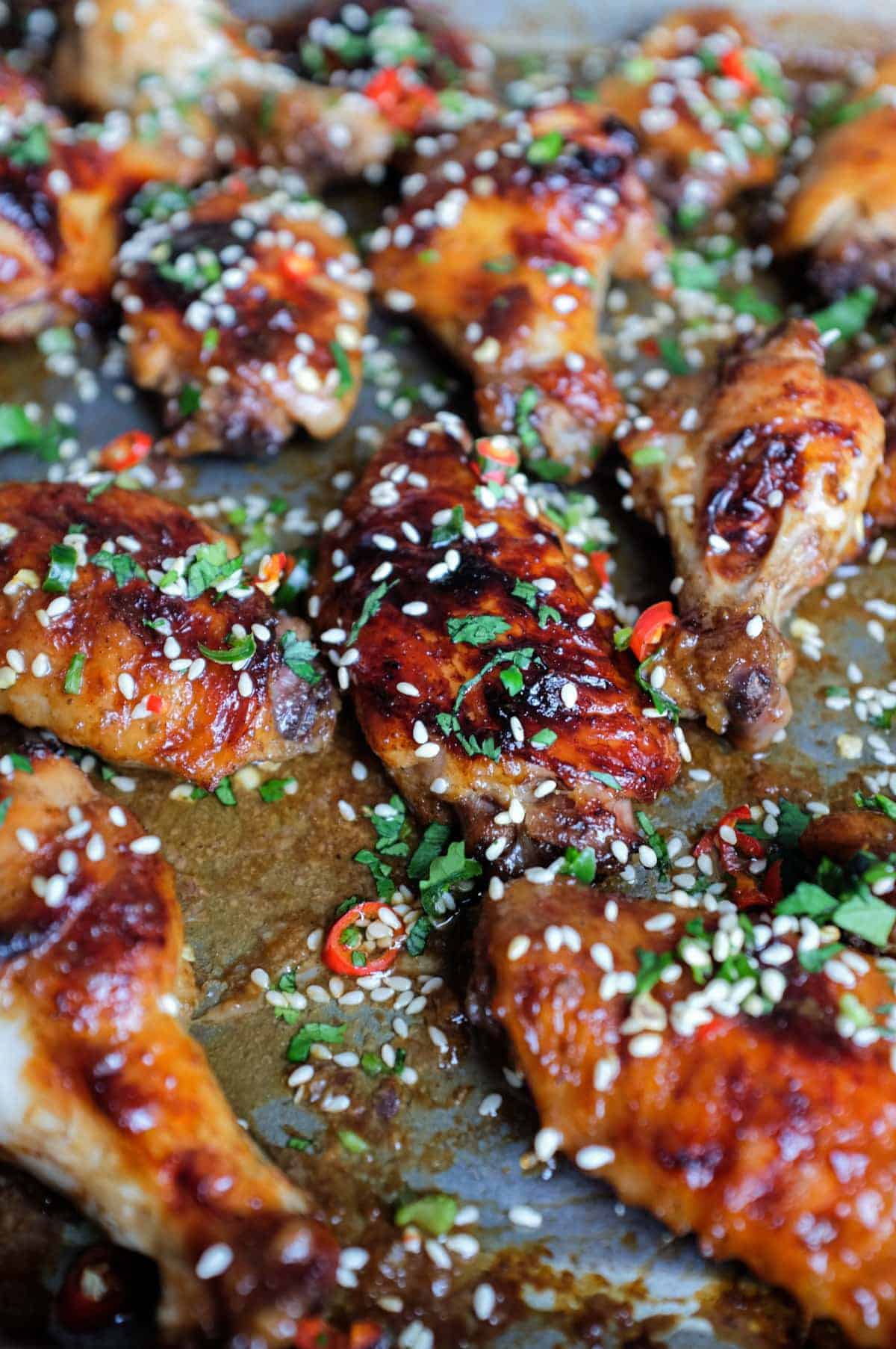 A baking sheet with Sticky Baked Chinese Chicken Wings