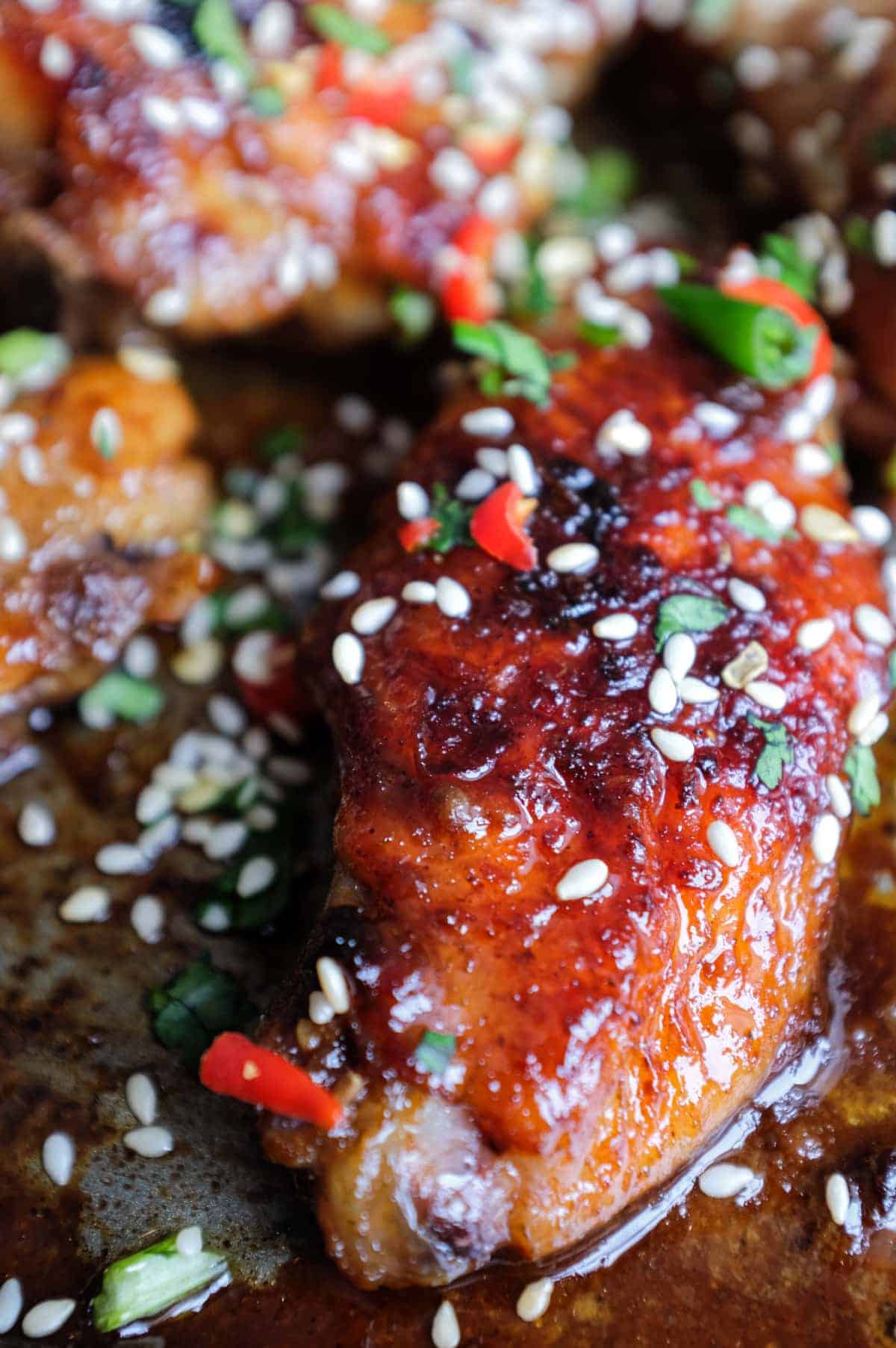 A baking sheet with Sticky Baked Chinese Chicken Wings