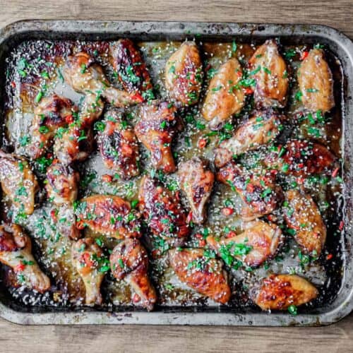 A baking sheet with Sticky Baked Chinese Chicken Wings